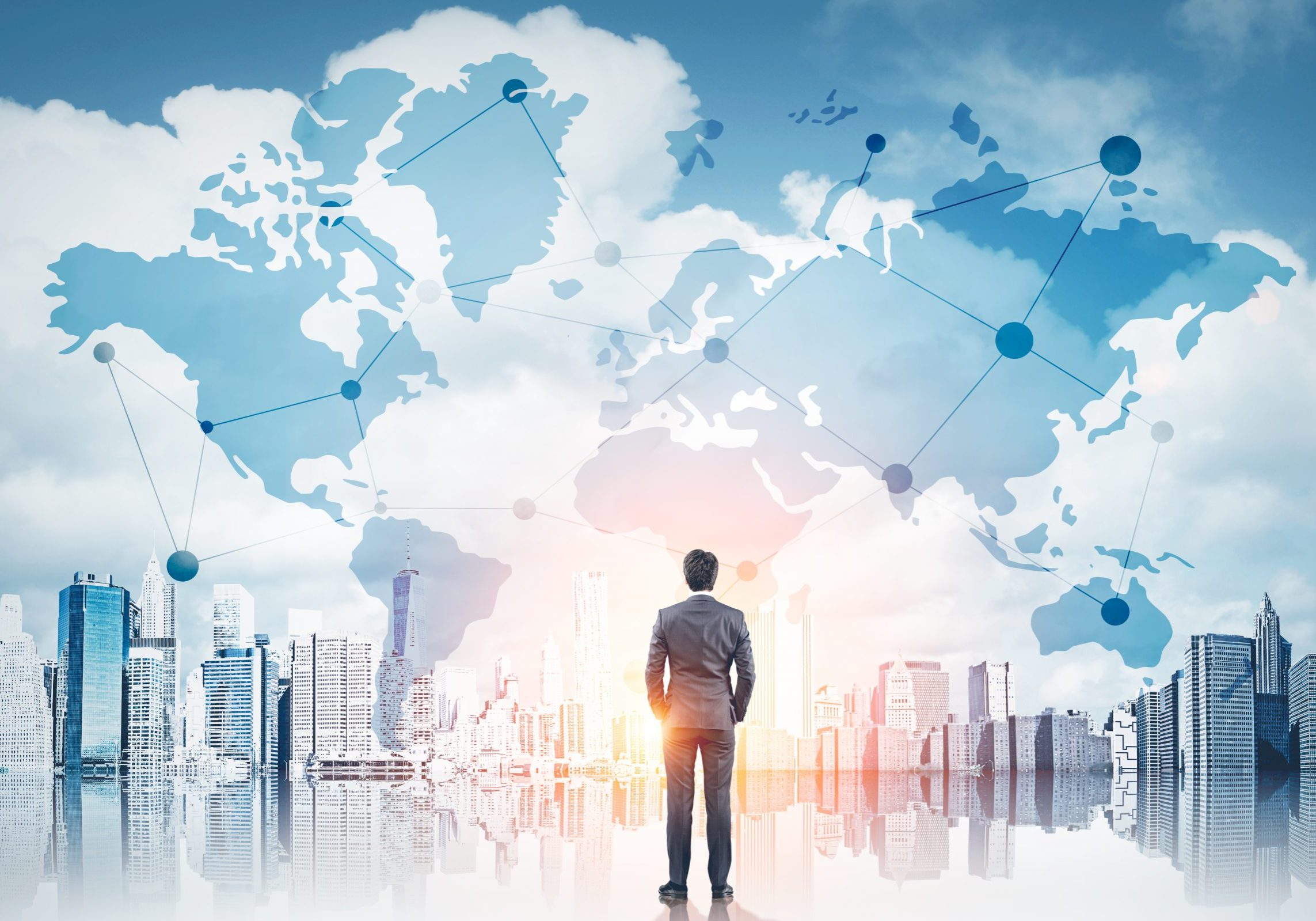 International business concept with businessman on New York city background with network on map and sunlight