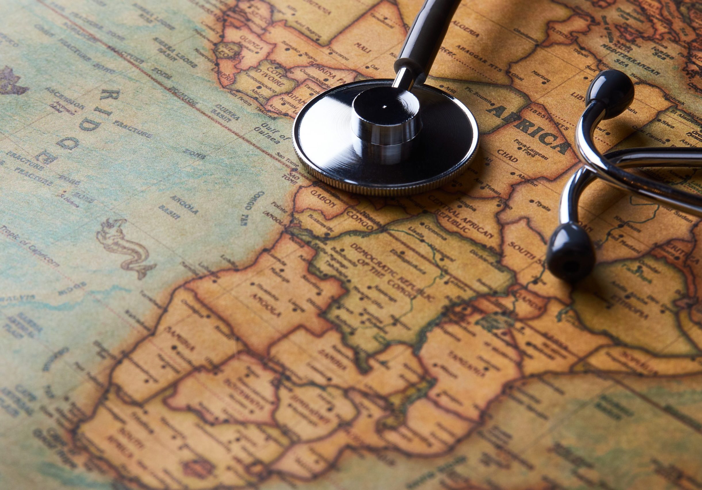 Medical stethoscope over Africa healthcheck. close-up map Medical stethoscope over Africa healthcheck. Fever vaccination concept tourism travel care diseases healthy, close-up. Stethoscope on map background with copy space, top view, selective focus.