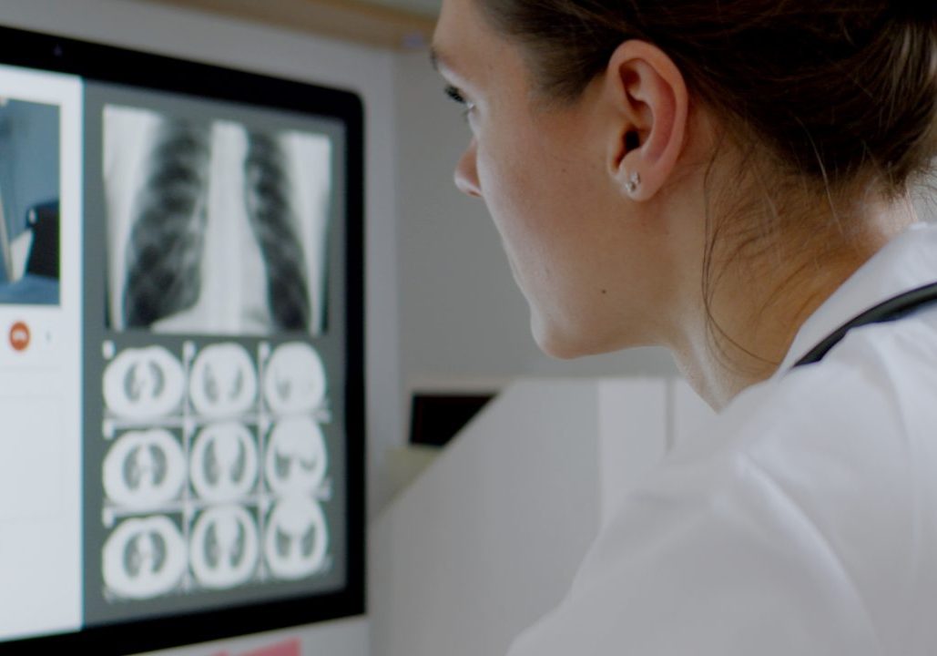 Caucasian female doctor delivering telemedicine consultation to a patient Caucasian female doctor delivering telemedicine consultation to a patient. Telehealth, telemedicine, remote consultation service. Coronavirus, COVID-19