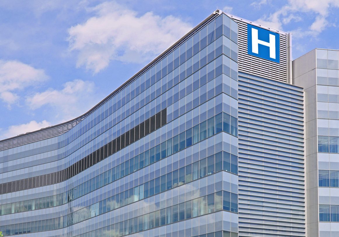 Building with large H sign for hospital Building with large H sign for hospital